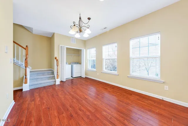 a view of an empty room with a ceiling fan