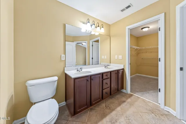 an aerial view of residential houses with outdoor space and ocean view
