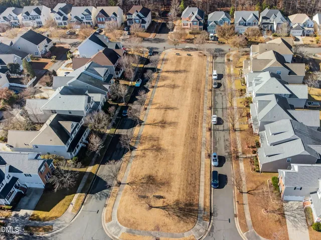 an aerial view of a house with a swimming pool