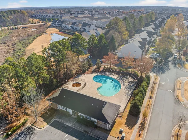 an aerial view of a house with a swimming pool