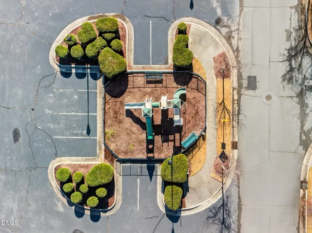 an aerial view of a residential houses with outdoor space