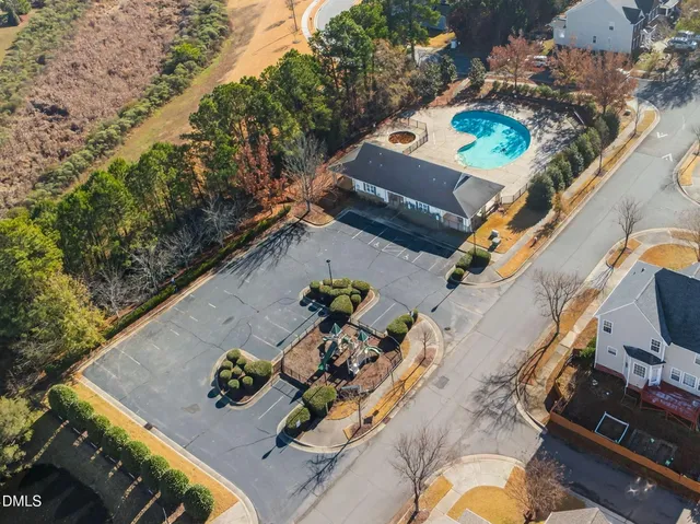 an aerial view of a house with garden space and patio
