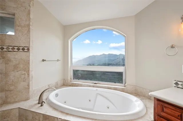 a view of a livingroom with a ceiling fan and window