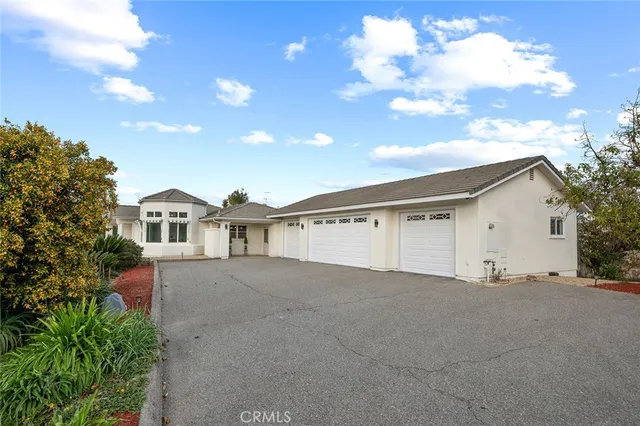 a large kitchen with stainless steel appliances granite countertop a stove and large refrigerator