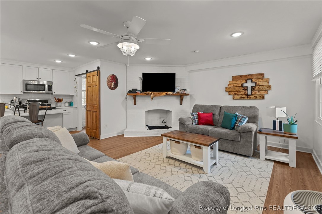 2060 Wade-Stedman Road Stedman, NC 28391 - Photo 14 of 41 a living room with furniture and a flat screen tv