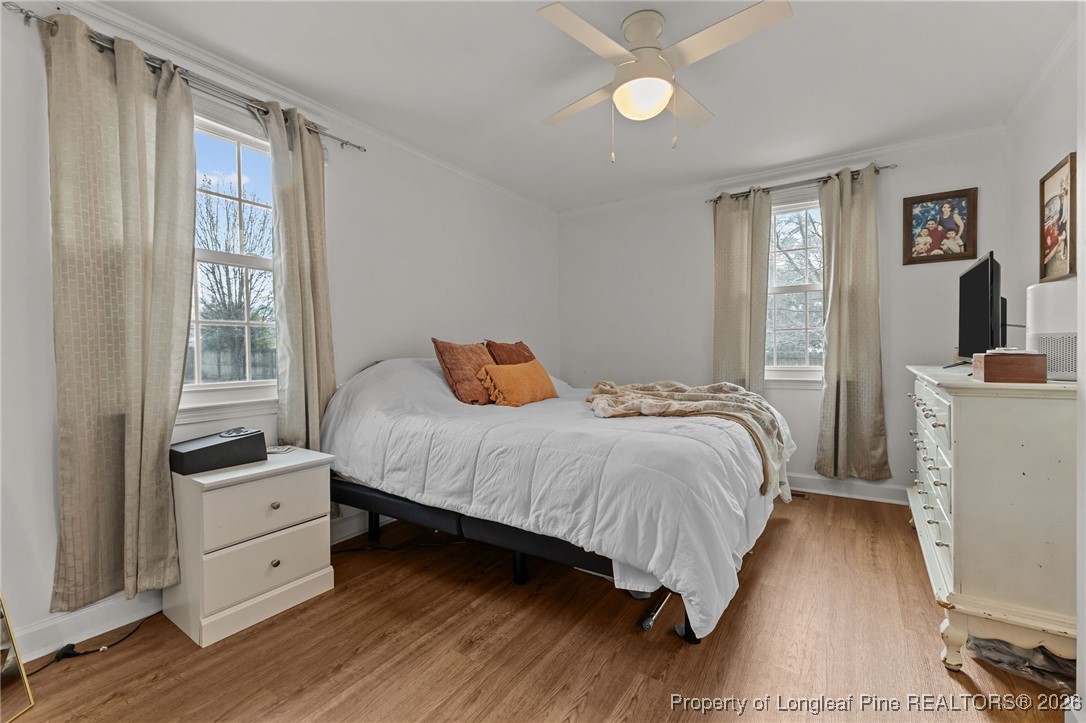 2060 Wade-Stedman Road Stedman, NC 28391 - Photo 17 of 41 a bedroom with a bed and a large window