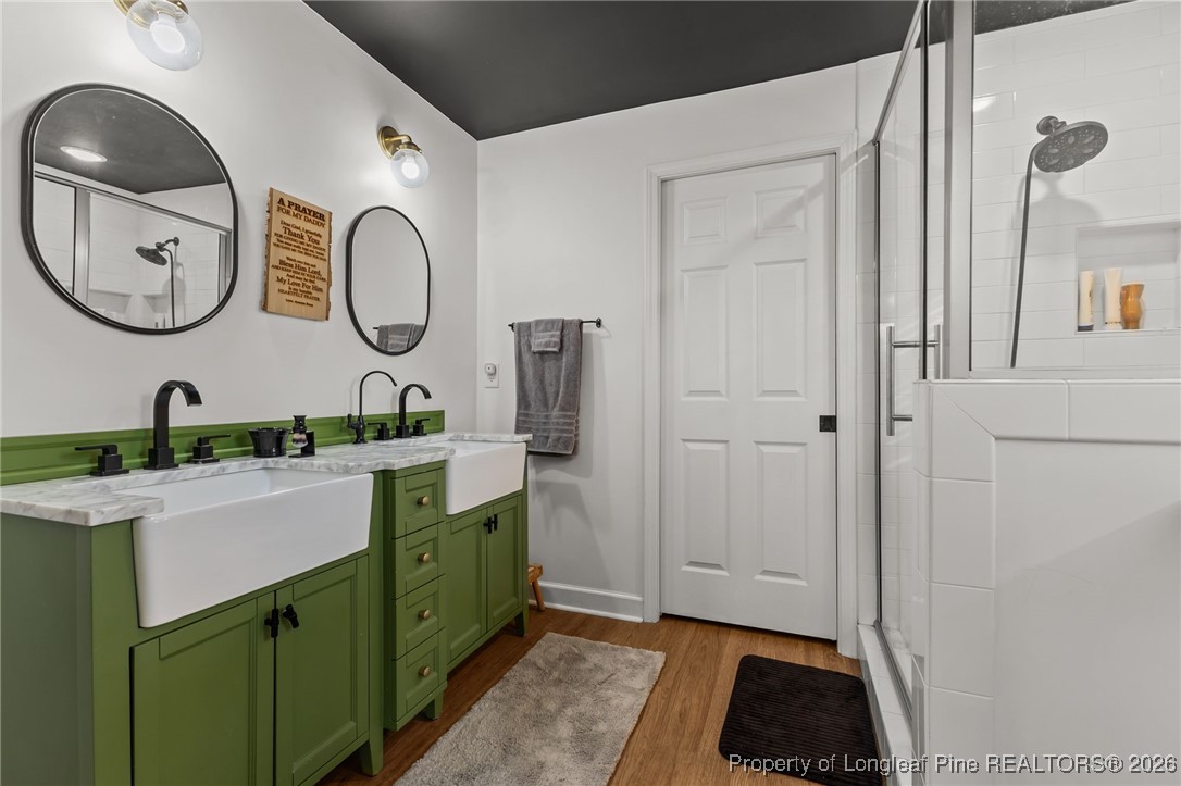 2060 Wade-Stedman Road Stedman, NC 28391 - Photo 19 of 41 a spacious bathroom with a double vanity sink and a mirror