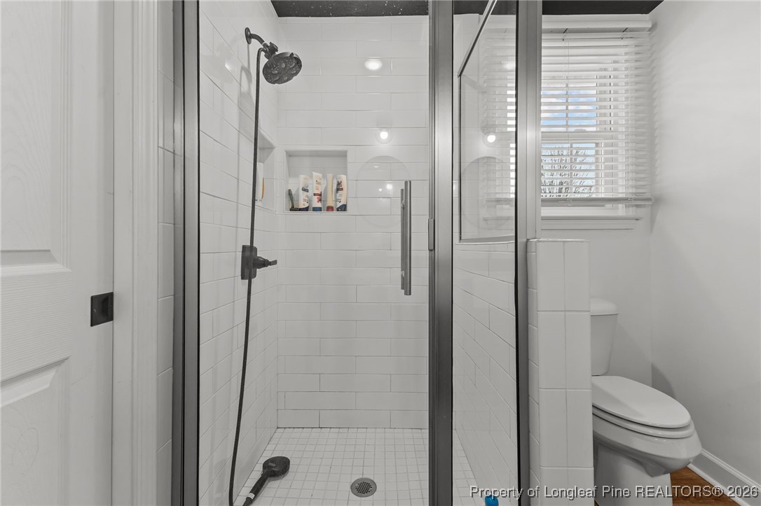 2060 Wade-Stedman Road Stedman, NC 28391 - Photo 20 of 41 a bathroom with a shower a toilet and a sink