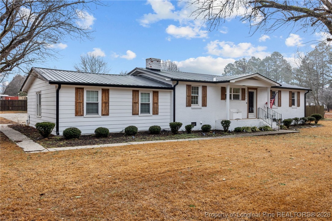 2060 Wade-Stedman Road Stedman, NC 28391 - Photo 2 of 41 a front view of a house with a yard