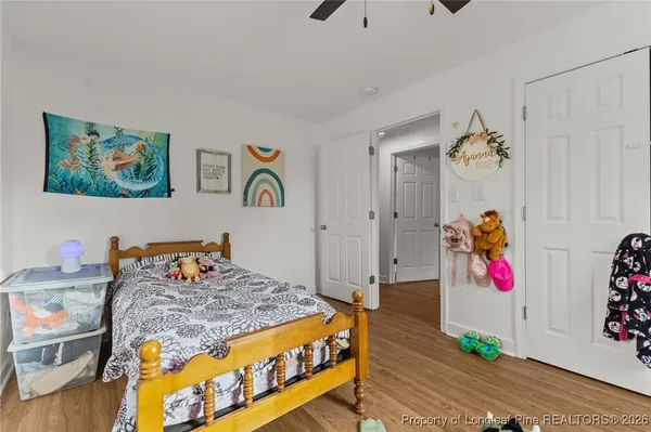 a bedroom with a bed and a couch