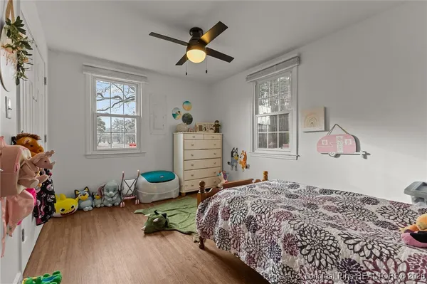 a bedroom that has a bed and a window