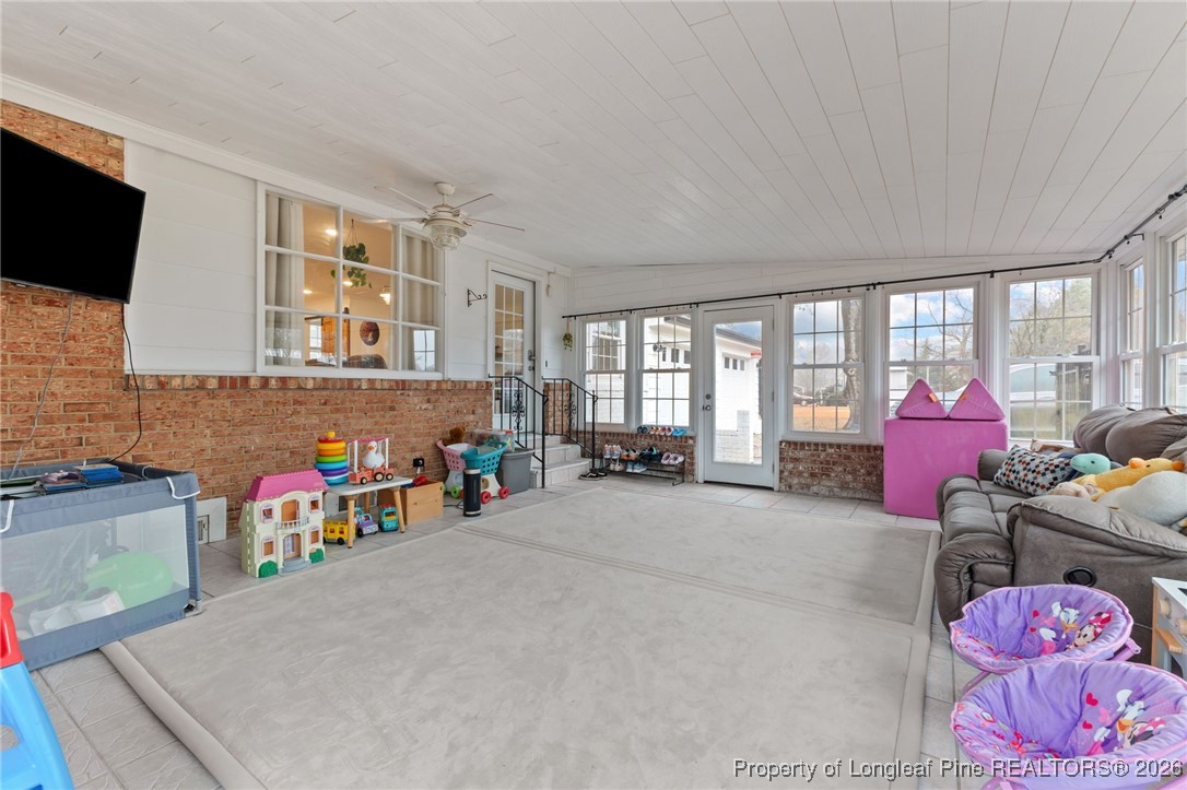 2060 Wade-Stedman Road Stedman, NC 28391 - Photo 26 of 41 a bedroom with furniture and a flat screen tv