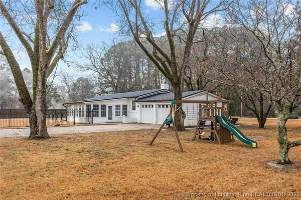 a house view with a backyard space