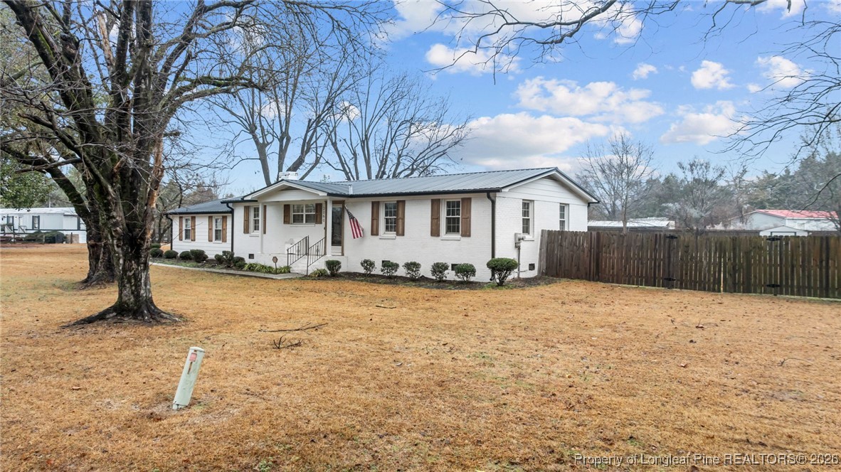 2060 Wade-Stedman Road Stedman, NC 28391 - Photo 37 of 41 a front view of a house with a yard