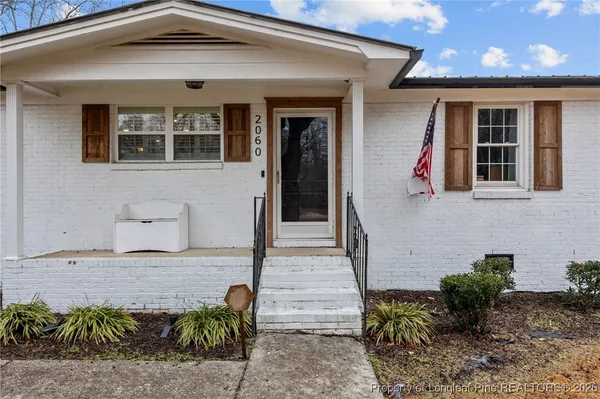 a front view of a house with glass windows