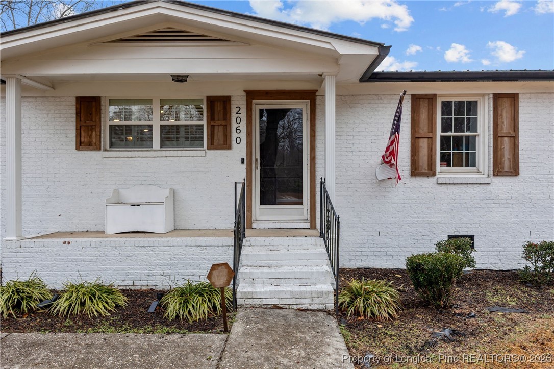 2060 Wade-Stedman Road Stedman, NC 28391 - Photo 4 of 41 a front view of a house with glass windows