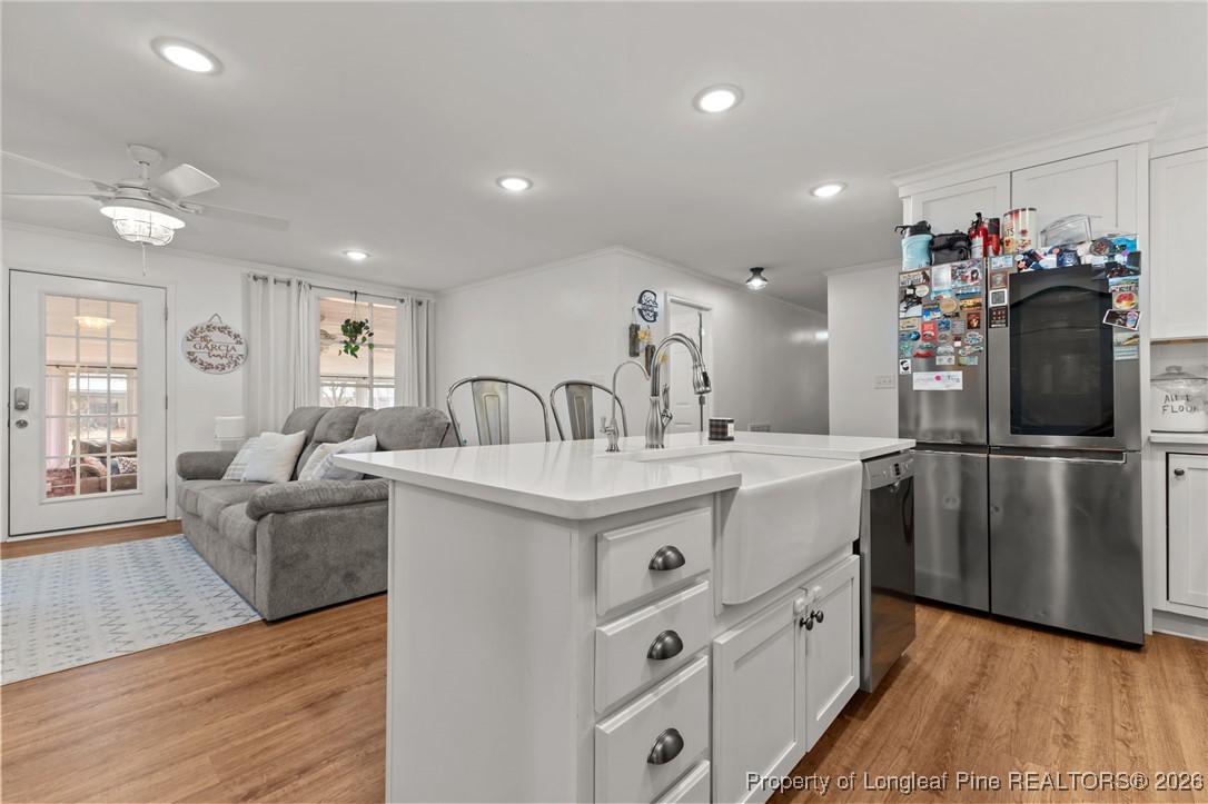 2060 Wade-Stedman Road Stedman, NC 28391 - Photo 8 of 41 a kitchen with kitchen island a sink stove and refrigerator