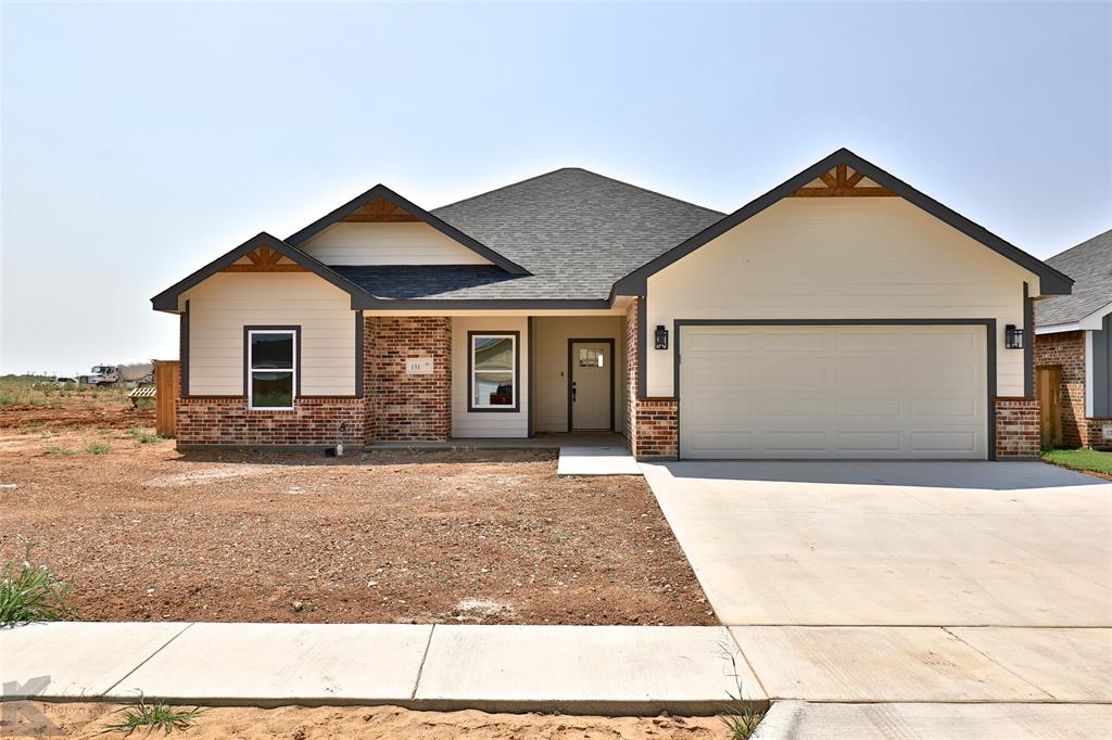 a front view of a house with yard