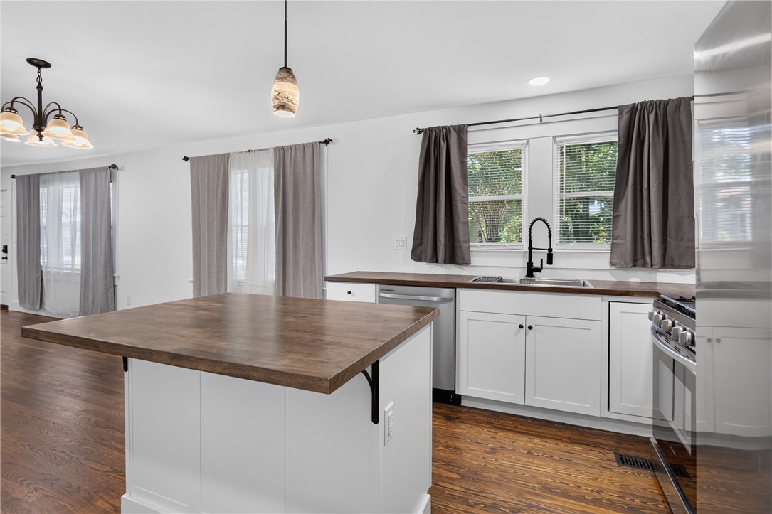 115 Pelfrey Street Seneca, SC 29672 - Photo 8 of 46 Heart of the home kitchen, with rich hardwood flooring and a stylish, functional island.