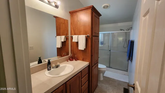 a bathroom with a sink and mirror