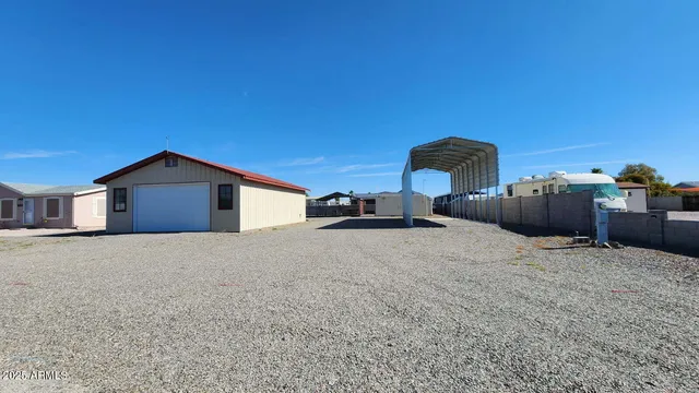 a big room with closet and a large window