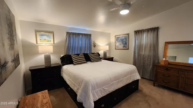 a bedroom with a bed and a dresser