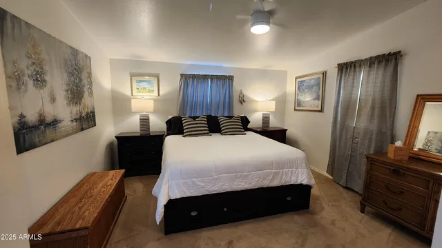 a bedroom with a bed and a television