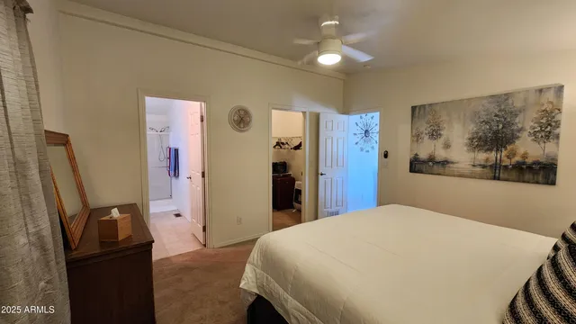 a bedroom with a bed and a mirror