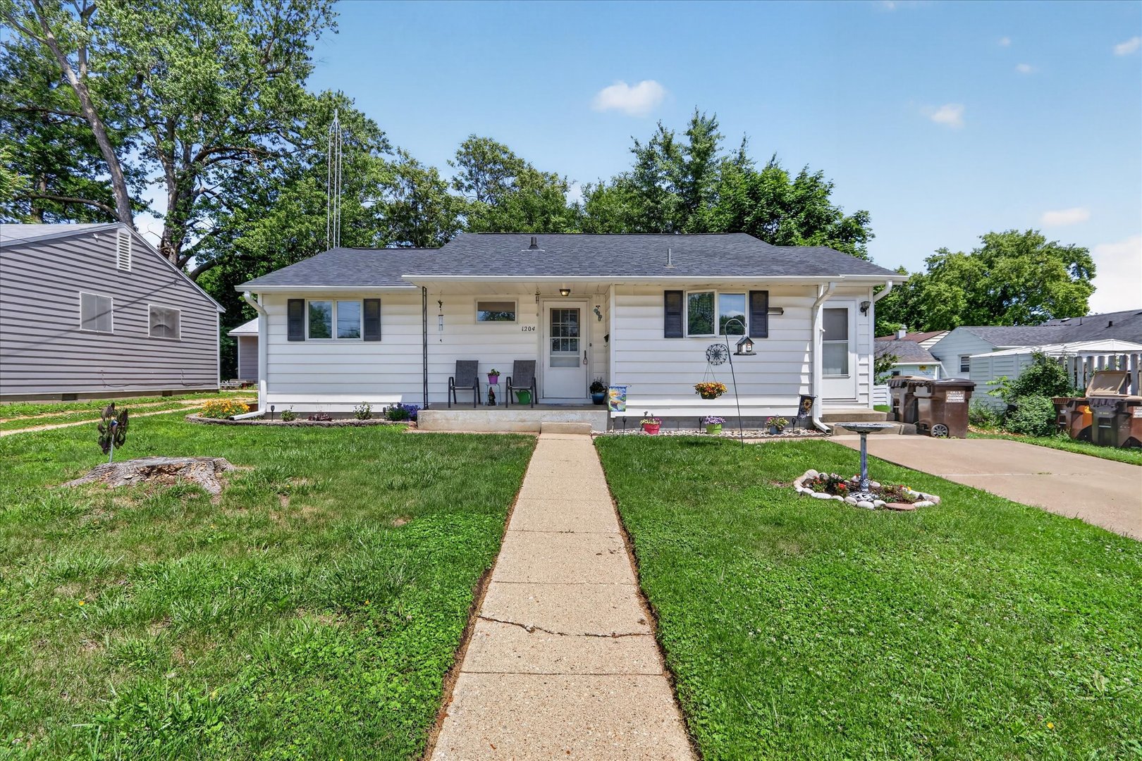 1204 West Violet Street Freeport, IL 61032 - Photo 1 of 36 a front view of a house with a yard and trees