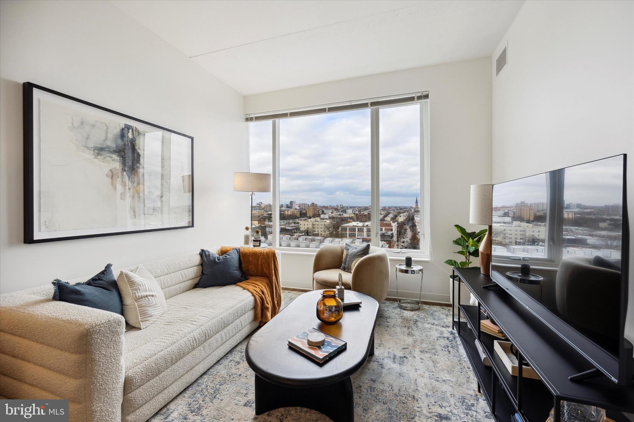 569 North 5th Street, Unit 236 Philadelphia, PA 19123 - Photo 5 of 46 a living room with furniture and a large window