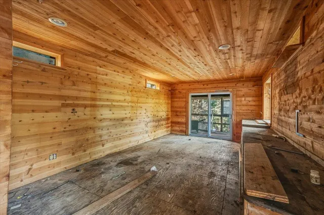 a view of backyard with hardwood area