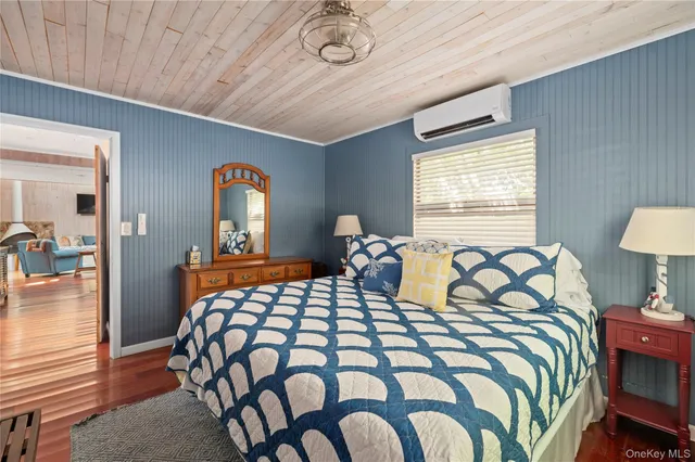 a bedroom with bed and a window