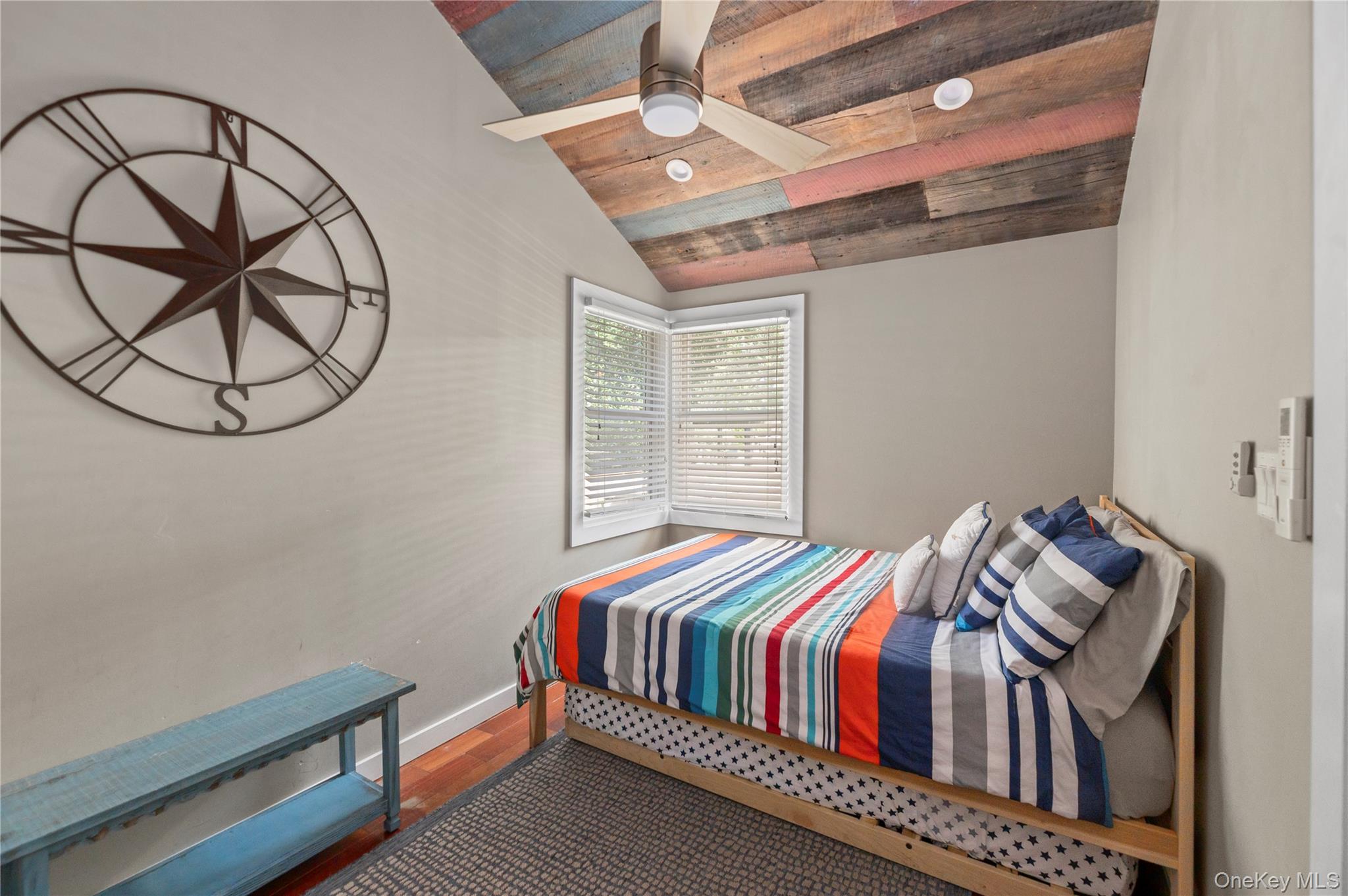 20 Seneca Walk Ocean Beach, NY 11770 - Photo 16 of 19 a bedroom with a bed a window and closet