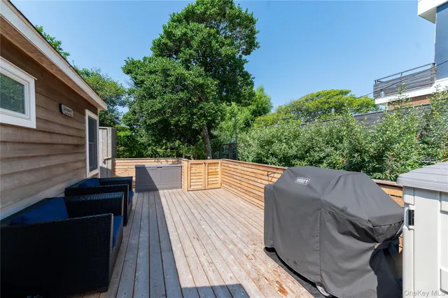 a view of a patio with couches and table and chairs