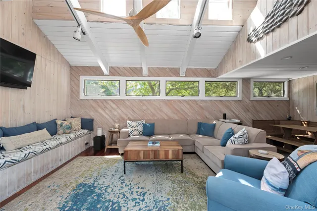 a living room with furniture and a window