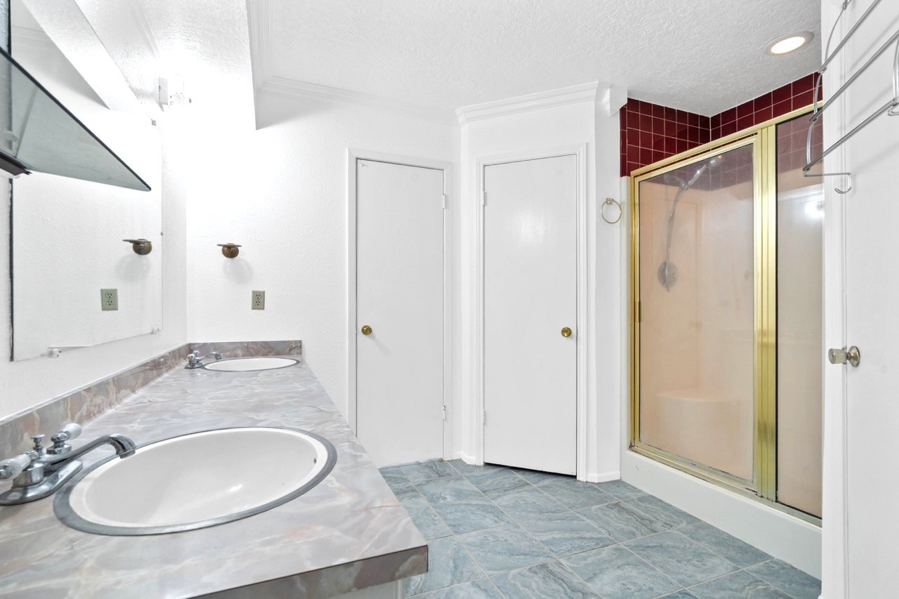 13180 Morgan Drive Splendora, TX 77372 - Photo 24 of 38 Primary bathroom with a walk-in shower, 2 closets and an enclosed toilet area (potty closet).