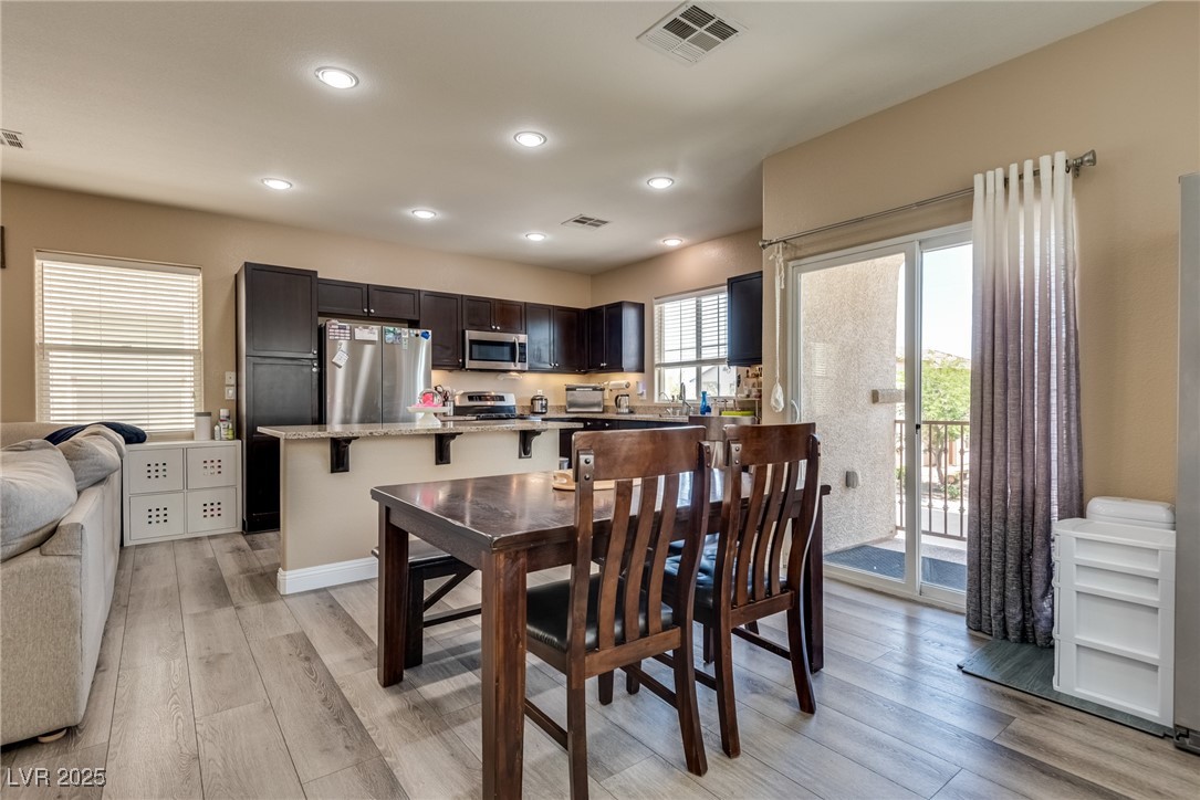 10519 Mann Street Las Vegas, NV 89141 - Photo 15 of 48 Dining room with light wood-type flooring and recessed lighting