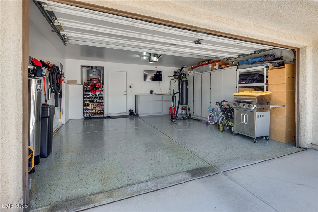 10519 Mann Street Las Vegas, NV 89141 - Photo 34 of 48 Garage with a garage door opener