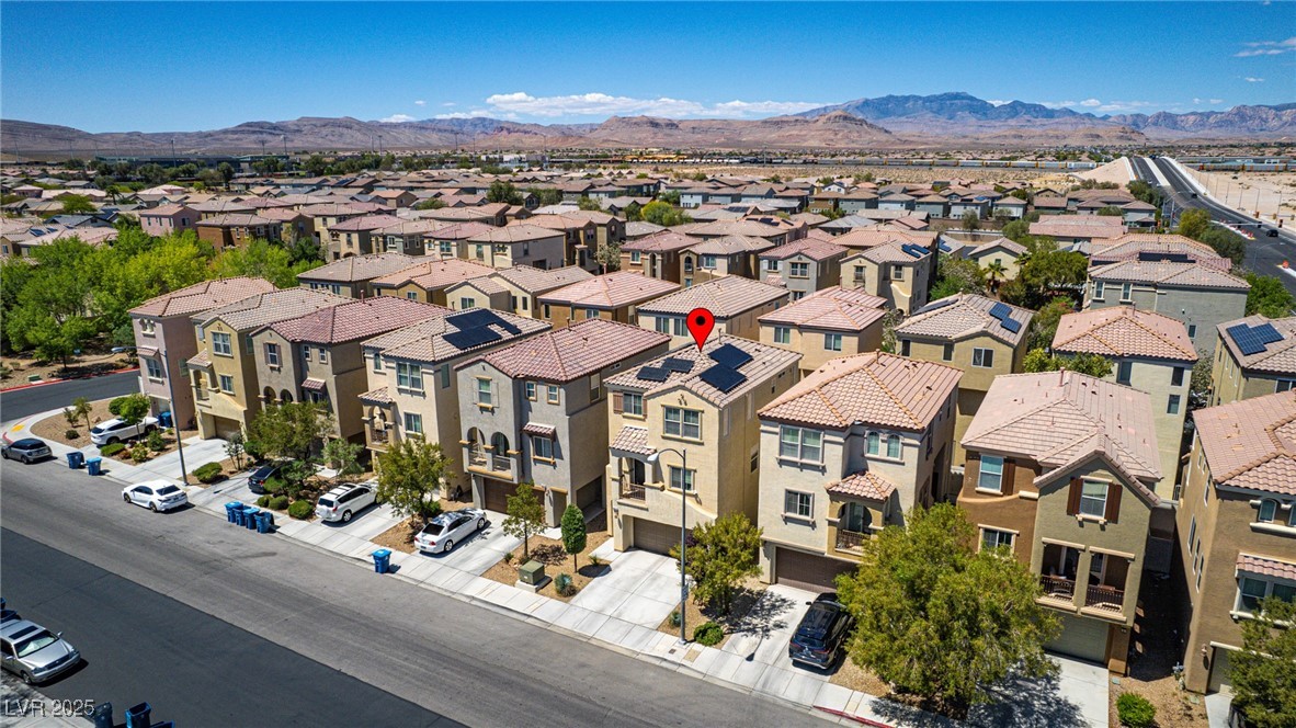 10519 Mann Street Las Vegas, NV 89141 - Photo 35 of 48 Aerial perspective of suburban area featuring mountains