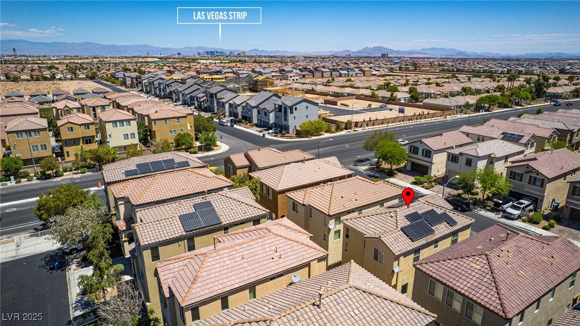 10519 Mann Street Las Vegas, NV 89141 - Photo 39 of 48 Aerial perspective of suburban area with a mountain backdrop