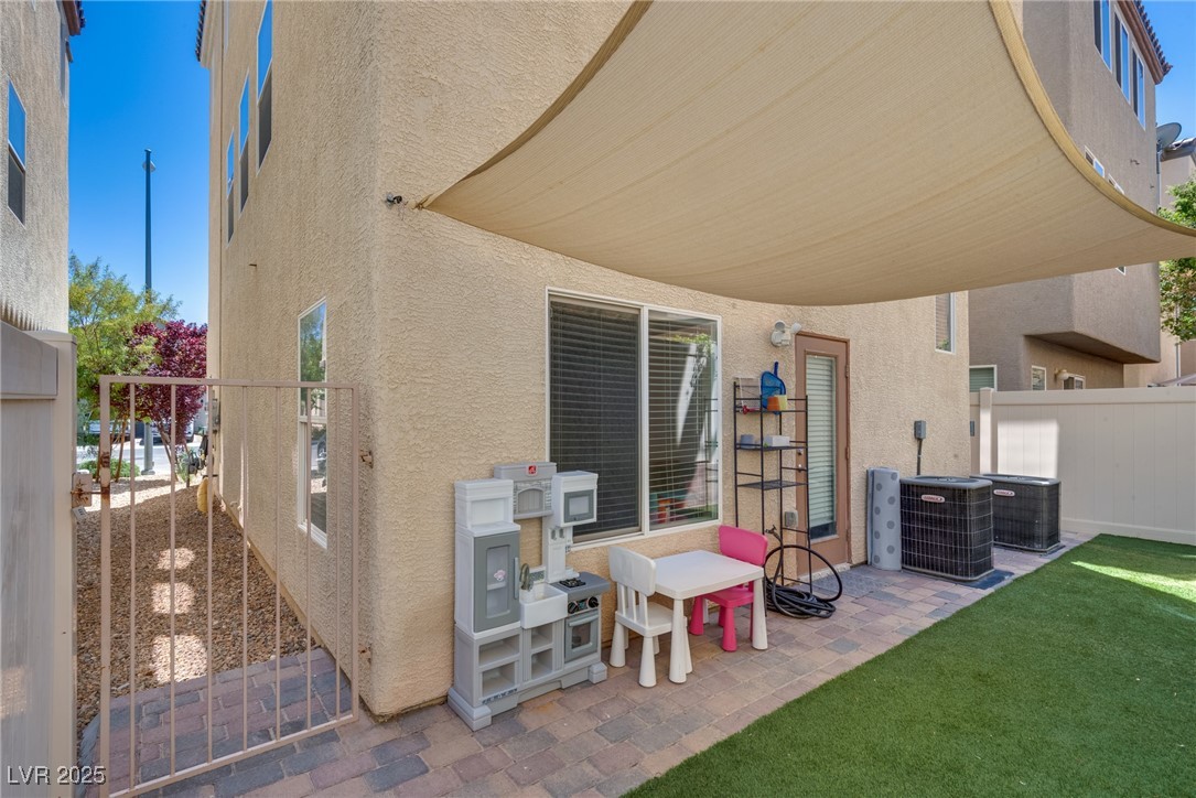 10519 Mann Street Las Vegas, NV 89141 - Photo 6 of 48 View of yard / terrace featuring fence and cooling unit