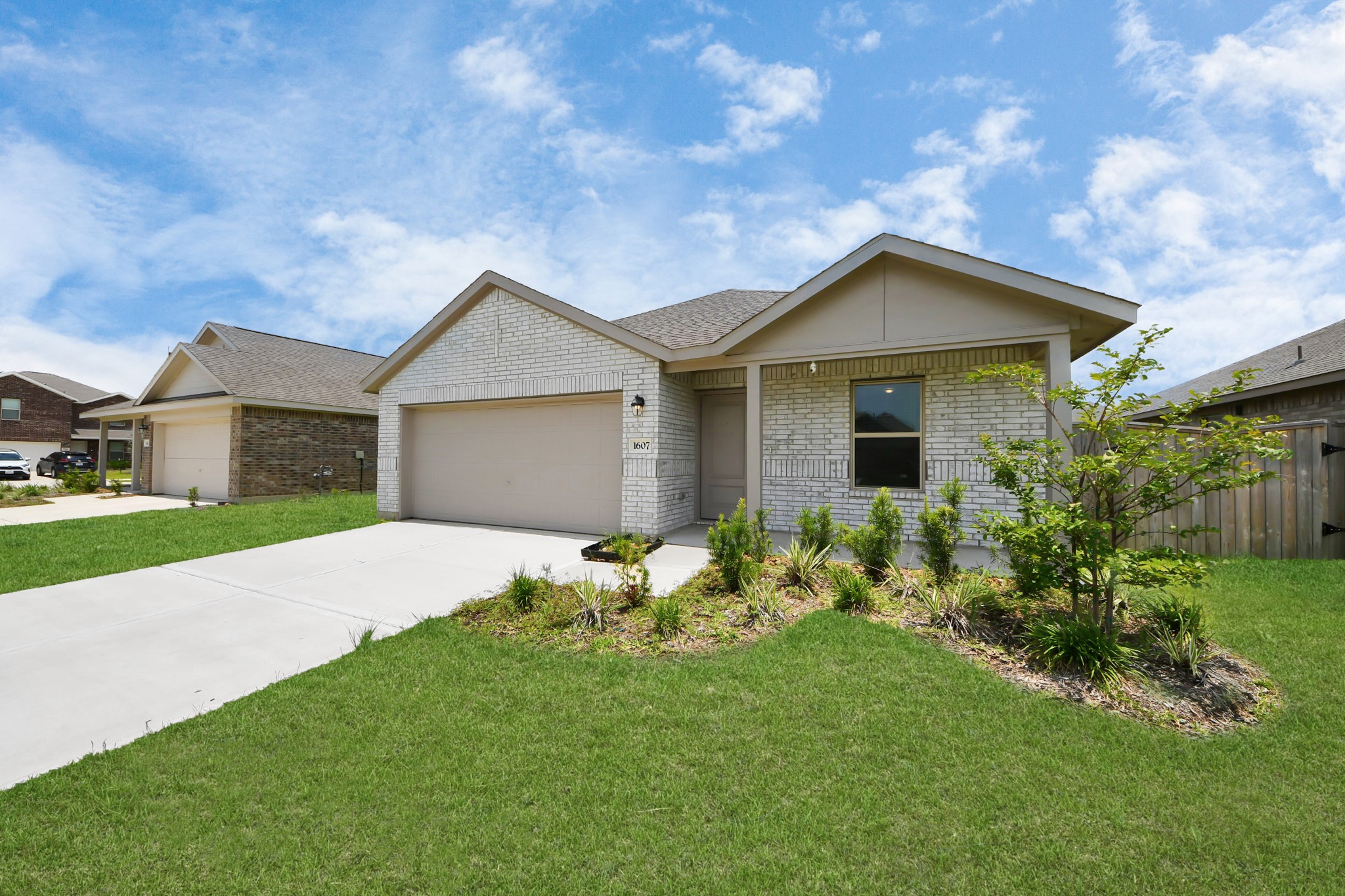 1607 Red Oak Drive Rosenberg, TX 77471 - Photo 1 of 39 Another view of the home’s exterior and front yard.