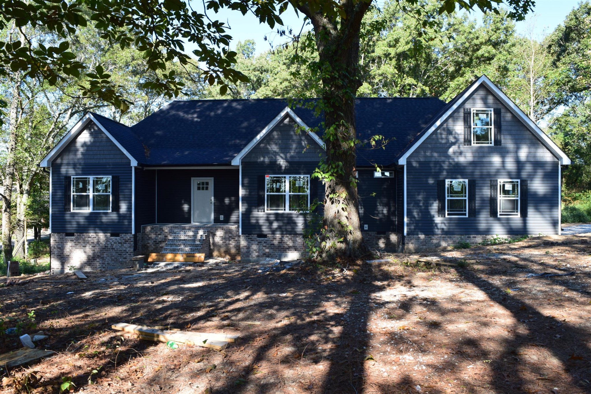 481 Mcelhiney Road Dickson, TN 37055 - Photo 6 of 6 a front view of a house with yard tree and outdoor seating