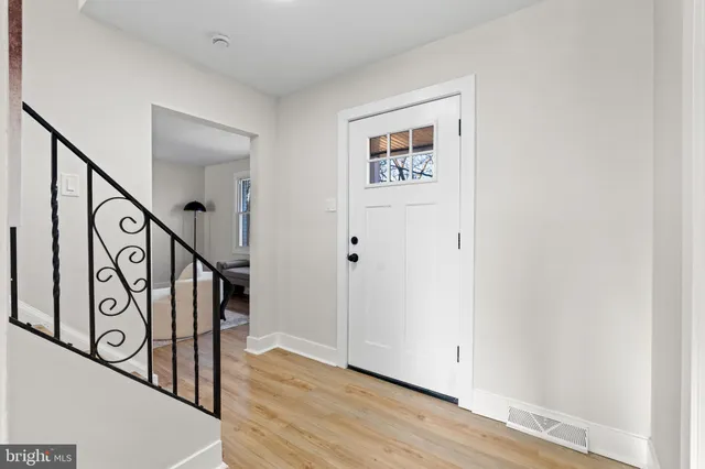 a view of an entryway with wooden floor