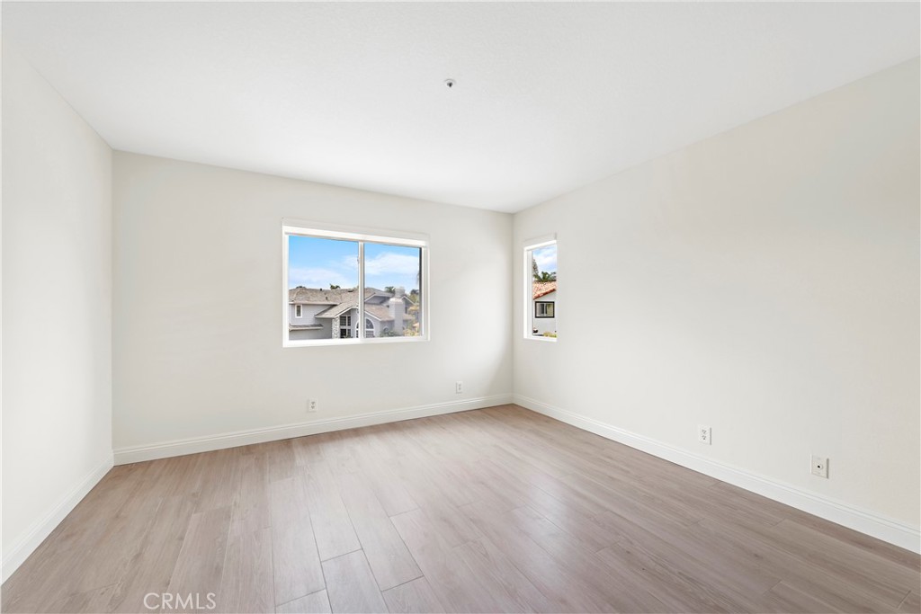 8 Via Jazmin San Clemente, CA 92672 - Photo 11 of 25 an empty room with wooden floor and windows