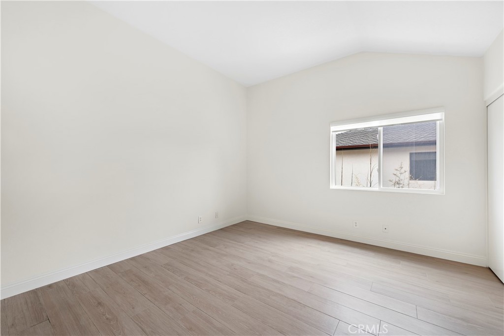 8 Via Jazmin San Clemente, CA 92672 - Photo 12 of 25 an empty room with wooden floor and windows