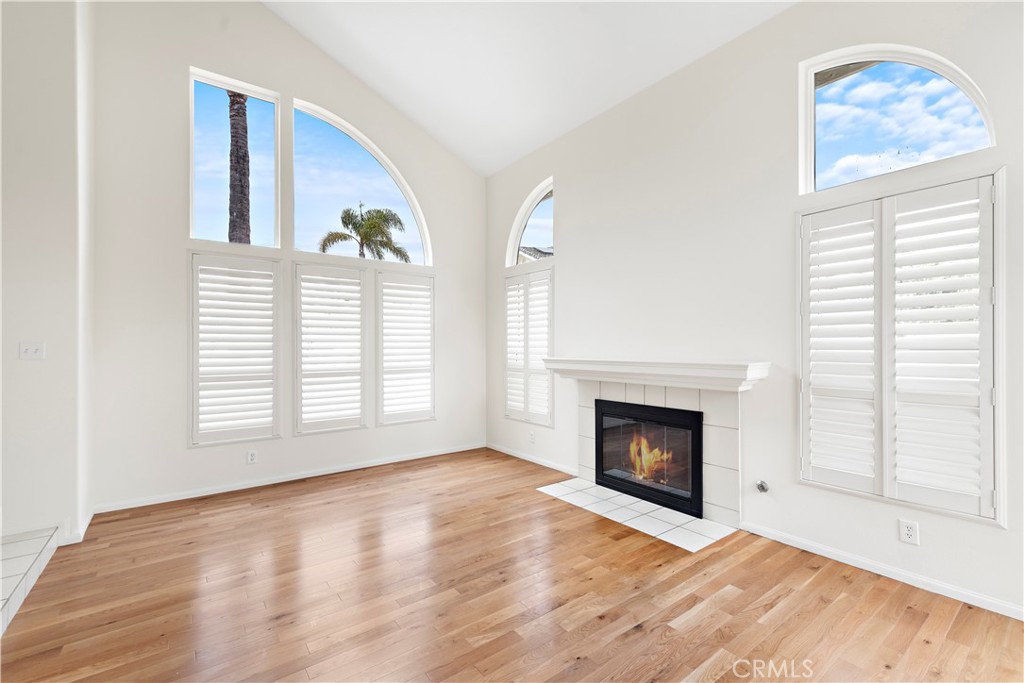 8 Via Jazmin San Clemente, CA 92672 - Photo 2 of 25 a view of an empty room with a fireplace and a window