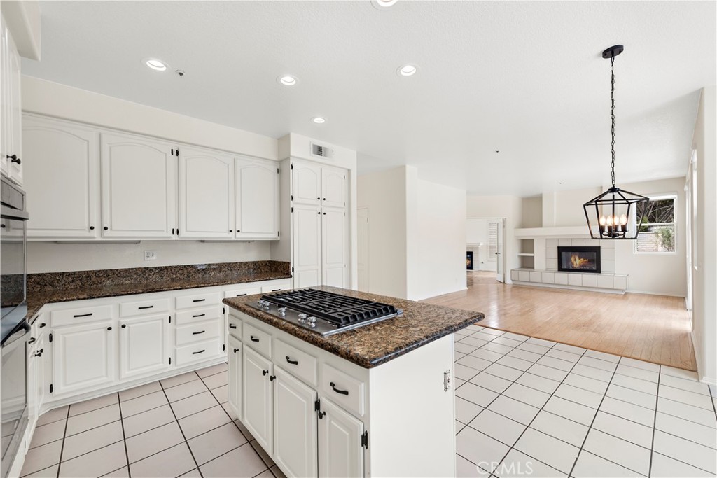 8 Via Jazmin San Clemente, CA 92672 - Photo 5 of 25 a kitchen with granite countertop a sink a stove and cabinets
