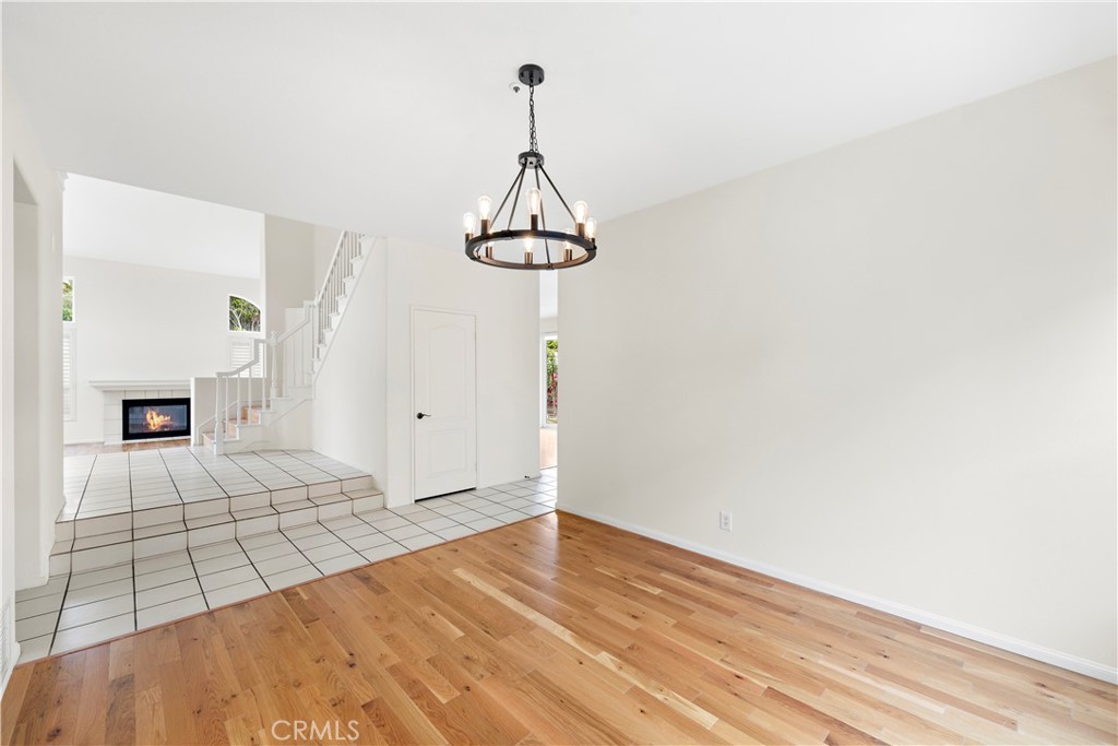 8 Via Jazmin San Clemente, CA 92672 - Photo 7 of 25 a view of empty room with wooden floor and fireplace