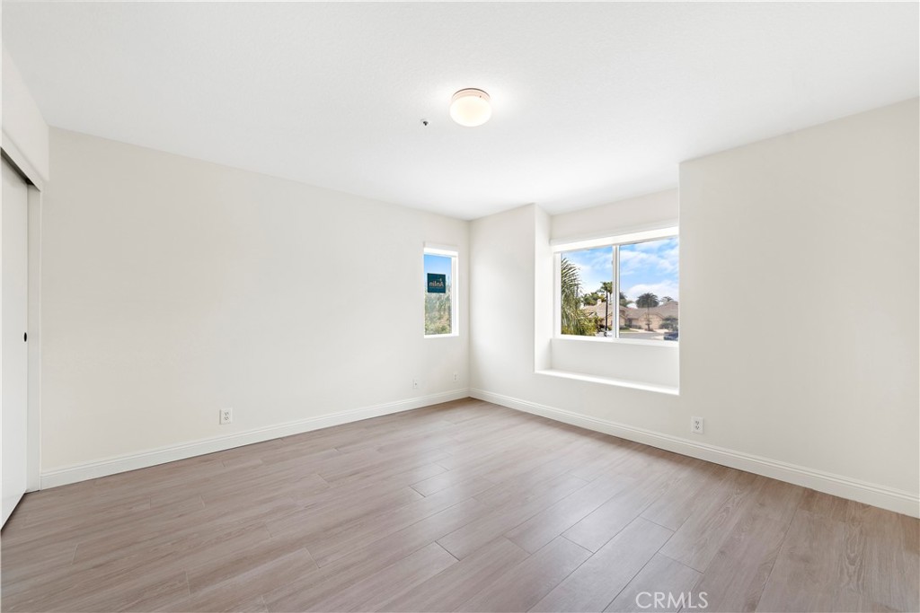 8 Via Jazmin San Clemente, CA 92672 - Photo 10 of 25 an empty room with wooden floor and window